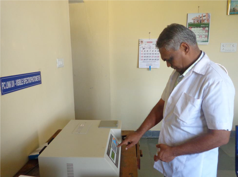 Dr. Patodkar Performing Experiment Ithe Laboratory
